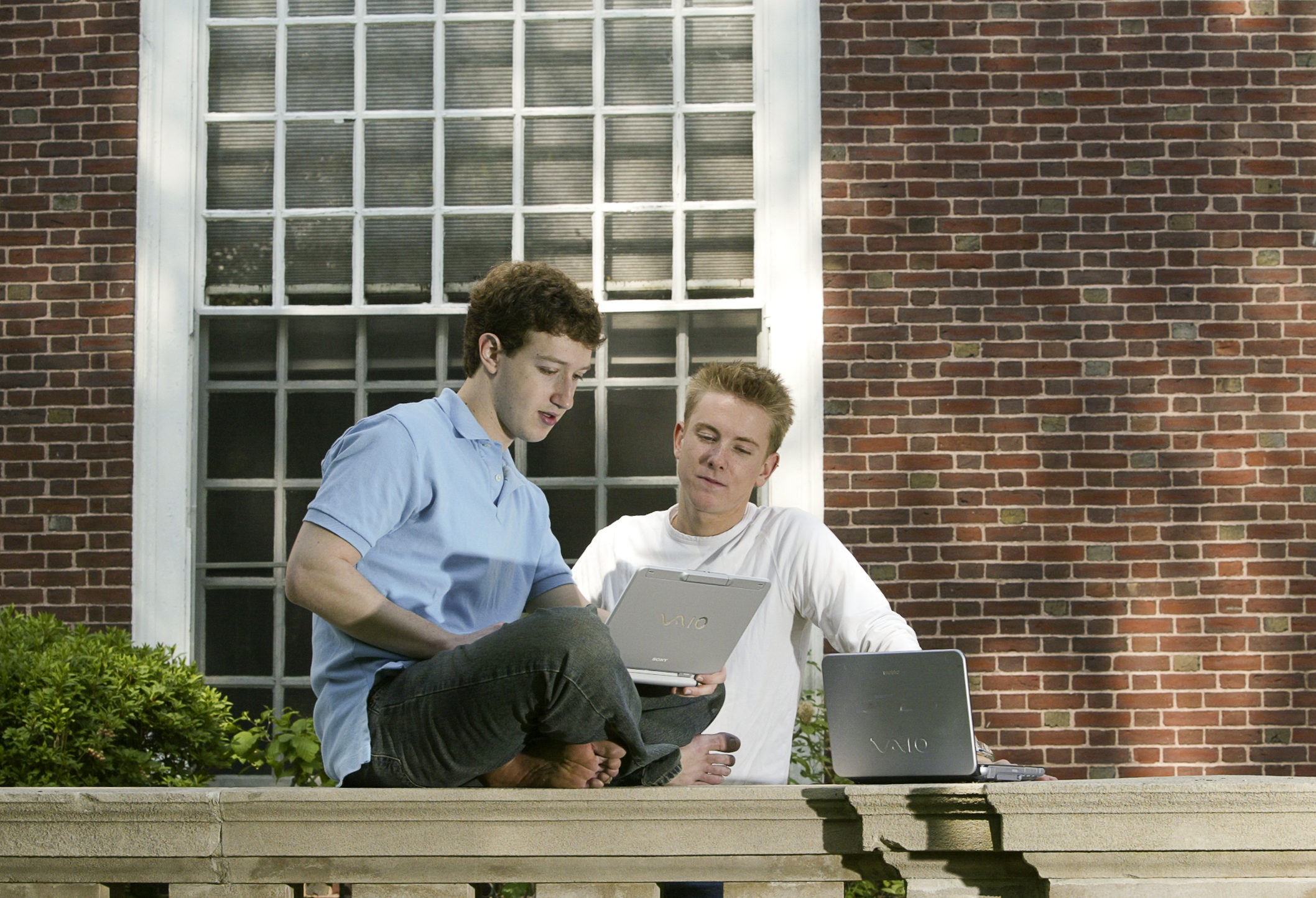 Zuckerberg with Facebook co-creator Chris Hughes in 2004